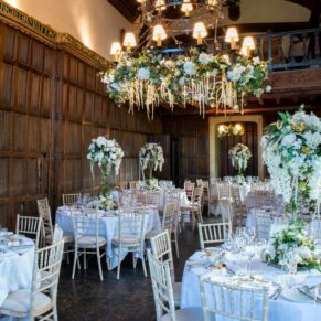 The Great Hall all setup with gorgeous white floral displays for this special wedding day