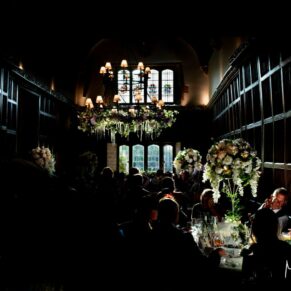 Atmospheric lighting in the Great Hall captured during the meal for this summer wedding at Weston Manor Hotel