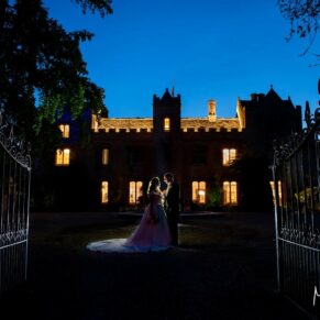 Silhouette portrait of the bride and groom taken at dusk in front of the fabulous Weston Manor Hotel