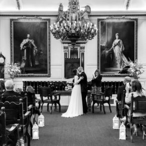 Photography of the first kiss captured during the wedding civil ceremony at the Guildhall in Windsor