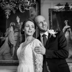 Photography of the newlyweds pose for the camera inside the Guildhall prior to their wedding reception at the Castle Hotel in Windsor