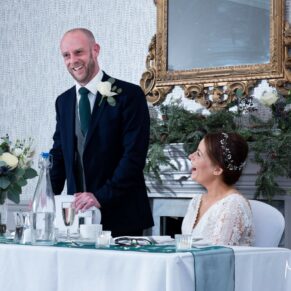 Photography of the groom's speech in full flow captured during the meal at his Castle Hotel wedding in Windsor