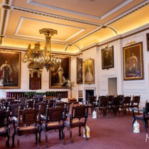 Majestic portraits of Royalty cover the walls inside Windsor's historic Guildhall
