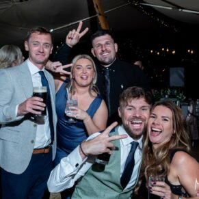 A group of guests pose for the camera during the lively evening's entertainment in the tipi