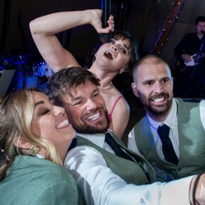 The singer joins a few the guests for a fun pose during the dancing inside the Dovecote Events tipi