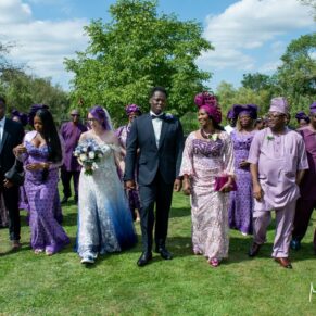 The groom's family wore the most colourful purple outfits on the day for this Great House in Sonning wedding reception