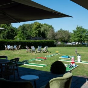 The wonderful riverside gardens with the wedding crazy golf setup at the Great House in Sonning