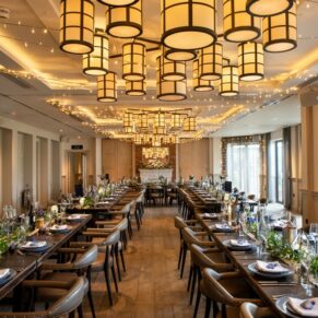 The striking dining room interiors setup prior the wedding breakfast at The Great House in Sonning