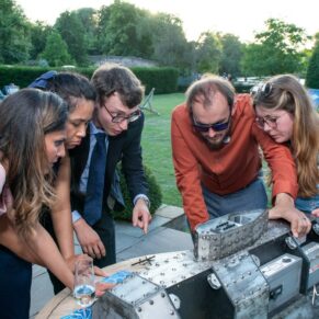 Wedding guests totally hooked with the table top escape room captured during the evening reception at The Great House in Sonning