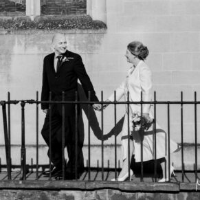 The bride and groom enjoy a walk past the church in the town before their Hotel Du Vin Henley wedding reception