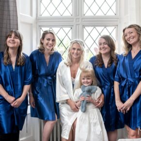 Photography of the bride with bridesmaids pre civil ceremony in the bridal suite at her Latimer Estate summer wedding