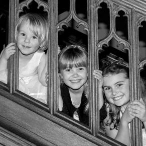 These giggling young girls were playing hide and seek on the staircase at the Latimer Estate
