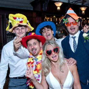 Fun times inside the photography booth for the newlyweds at their Latimer Estate wedding