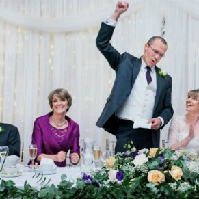 The groom punches the air during his lively Latimer Estate wedding speech