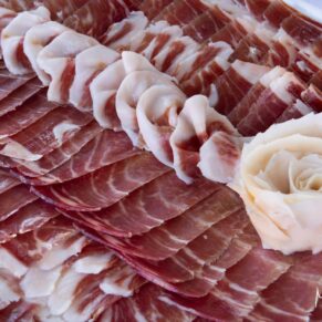 Yummy Iberico ham for the guests during the drinks reception at this Spanish themed Rackleys Barn wedding