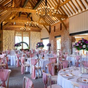 Vibrant wedding breakfast interiors inside this historic barn at Rackleys Barn