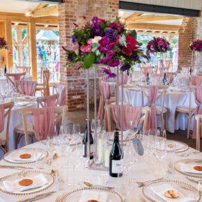 Striking floral displays for this colourful wedding at Rackleys Barn