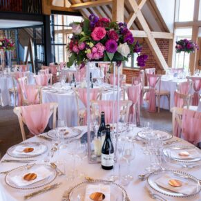 Wonderful table centres inside Rackleys Barn captured just before the wedding breakfast