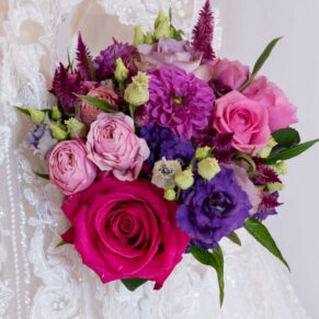 The brides red and pink wedding bouquet captured just prior to her civil ceremony at Rackleys Barn