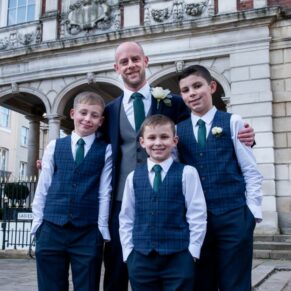 The groom with his young ushers pose for the camera outside the Guildhall in Windsor before the wedding ceremony