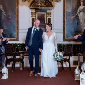 The happy newlyweds exit their magical wedding ceremony in the grand surroundings of the Windsor Guildhall