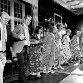 Photography of the lively Ceilidh dancing and partying during this Bisham Abbey wedding