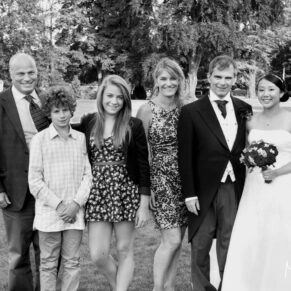 Bisham Abbey wedding guests pose for the camera during the drinks reception photography captures