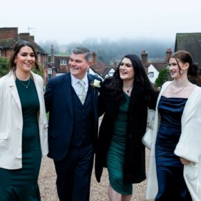 The smiling groom arrives at the Kings Chapel venue with his daughters