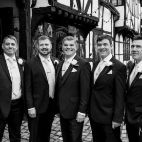 The groom and the lads gather for a photo in the High Street outside the Kings Chapel before the wedding ceremony