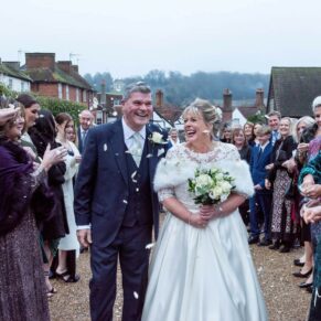 The newlyweds were not deterred by the freezing December conditions when we ventured outdoors for the confetti aisle at their Old Amersham wedding. After the smiling couple had dashed through the sea of rose petals, we were soon back in the warmth of the historic Kings Chapel. Bringing movement into wedding pictures always adds so much life and fun into your stills captures on the day. The jovial newlyweds make their way through the confetti aisle at their winter wedding reception
