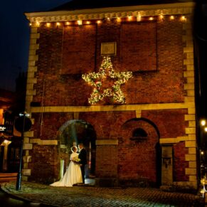 For this Kings Chapel bride and groom, they were really keen to venture along Old Amersham High Street after dusk! It was a freezing cold December day, but they were up for the challenge on the day. We stopped off at 5 different nearby locations for some dramatic poses whilst using my floodlighting tricks. One of my favourites was this shot of the newlyweds with the Old Amersham Market Hall, whilst the sparkling star really added to the magic of this surreal pose. Before we all froze, we were soon back indoors at the Kings Chapel to warm up once again! The Kings Chapel newlyweds captured in Old Amersham High Street at dusk on their Christmassy wedding day