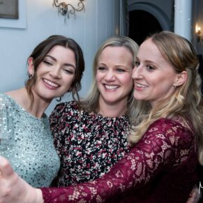 Three ladies decide its selfie time at the Kings Chapel wedding reception in Old Amersham