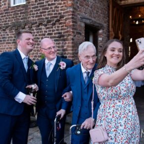 A few guests capture a selfie in the courtyard at Meols Hall