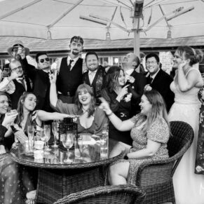 The newlyweds and their friends strike a pose at Meols Hall during the drinks reception