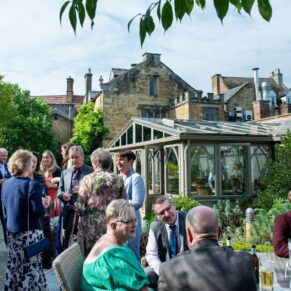 The drinks reception in full swing for this summer wedding
