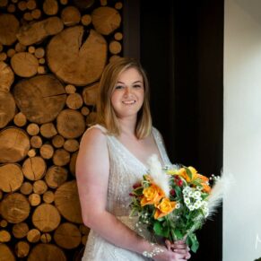 A dramatic window lit bridal portrait captured inside the historic hotel