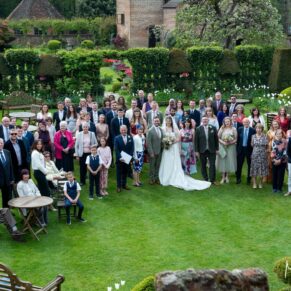 Group shot of everyone captured from above in the gorgeous gardens of Chenies Manor