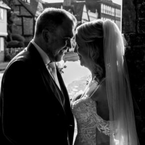 The newlyweds captured in a dramatic silhouette pose at their Kings Chapel Old Amersham wedding