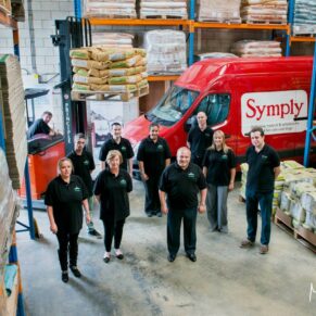 Commercial photography assignments for small businesses in the Buckinghamshire and Hertfordshire areas and beyond - this photograph showcases the owner and his warehouse team in a relaxed pose at their company head quarters