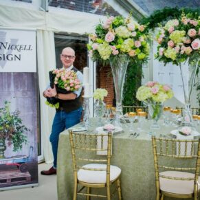 Commercial photography assignments for small and large businesses in the Buckinghamshire area and beyond - this photograph showcases a florist set up for an exhibition on his colourful display stand