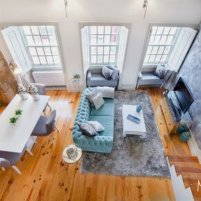 Commercial holiday home interiors photography assignment for ABNB hosts in Buckinghamshire - this photograph showcases a dramatic high ceiling luxury apartment with huge windows
