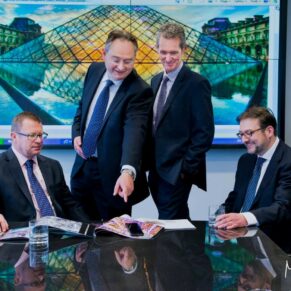 Commercial business photography portraits for small companies in the Buckinghamshire and Hertfordshire areas and beyond - this photograph showcases the board of directors in a relaxed pose in their executive meeting room
