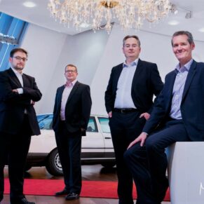 Commercial business photography portraits for small businesses in the Buckinghamshire and Hertfordshire areas and beyond - this photograph showcases the directors in a relaxed pose at their company head quarters