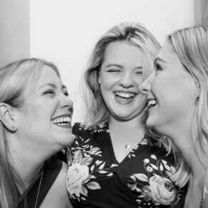 Buckinghamshire events photography capturing three ladies enjoying the banter during the drinks reception