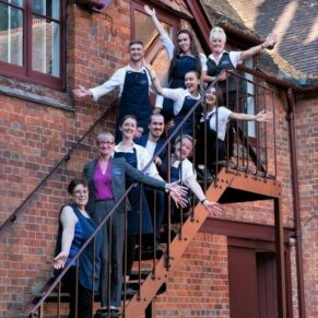 Buckinghamshire events photography capturing the staff at The Five Arrows Hotel in Waddesdon larking around for the camera