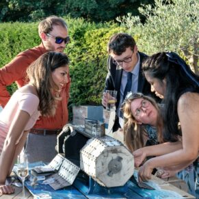Buckinghamshire events photography - delegates try to crack the code in this table top escape room