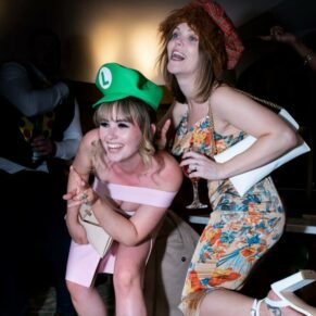 Buckinghamshire events photography of two ladies larking around in the photo-booth at the staff Christmas party