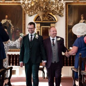 The happy newlyweds leave their civil ceremony after their Windsor Guildhall wedding