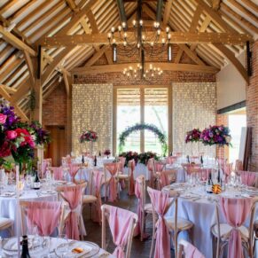 Interiors photography of the historic barn at this wonderful Buckinghamshire wedding venue prior to the meal