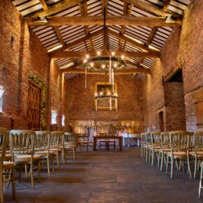 Interiors photography of the vast historic barn interior at this wonderful Buckinghamshire wedding venue